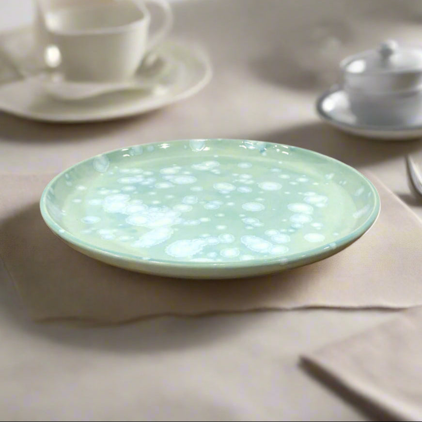 Beautiful modern dinner plate, 25cm wide, glazed with torquise Celadon glaze